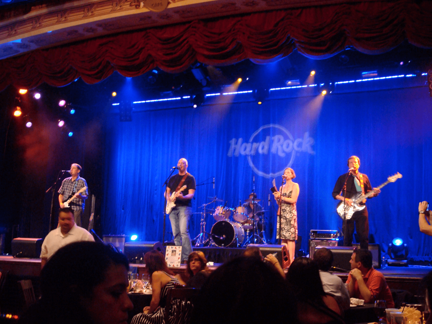 A band performing on stage at a concert.